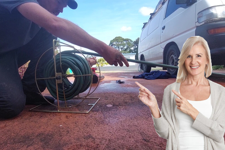 
A hose is carefully stored as a narooma gutter cleaner finishes up a day of rinsing.
